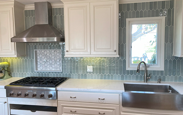 Kitchen with blue-green elongated hexagon backsplash tile